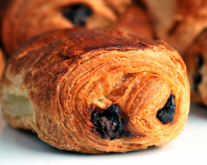 Just Jump Blog Banner - Pain au Chocolat vs. Chocolatine The Delicious French Pastry Debate